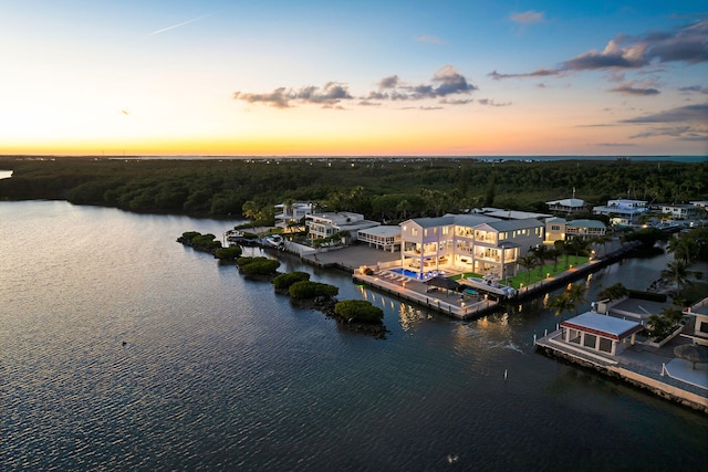 aerial view at dusk with a water view