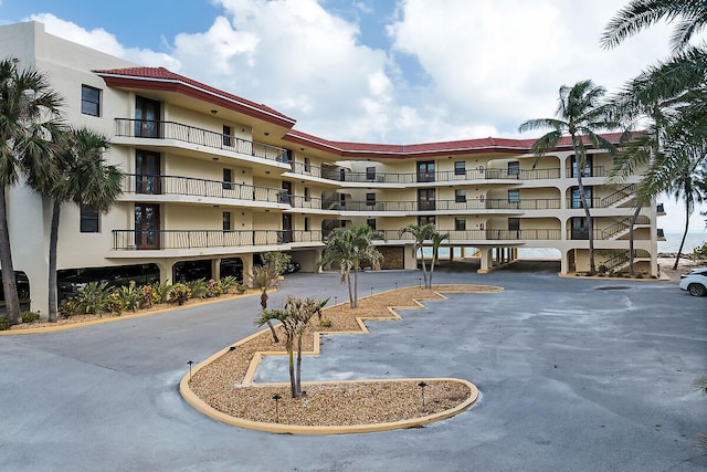 view of property featuring covered parking