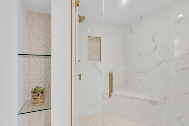 full bath featuring a marble finish shower