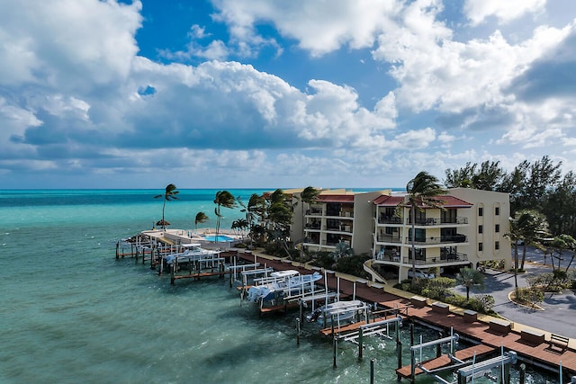 property view of water featuring a boat dock and boat lift