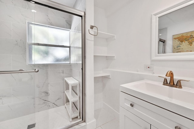 bathroom featuring vanity and a shower with shower door