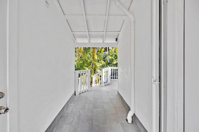 corridor featuring floor to ceiling windows