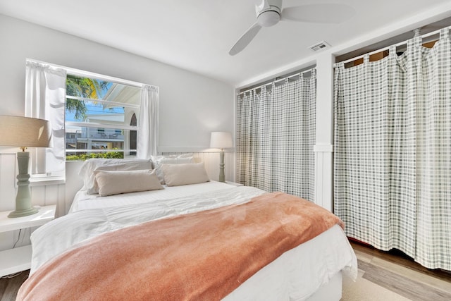 bedroom with wood-type flooring and ceiling fan