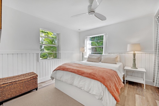 bedroom with ceiling fan and light wood-type flooring