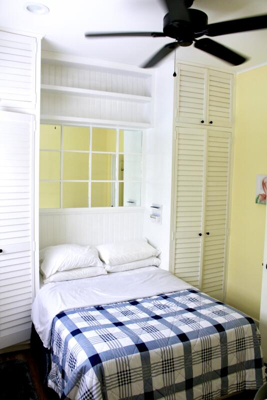 bedroom featuring ceiling fan and a closet