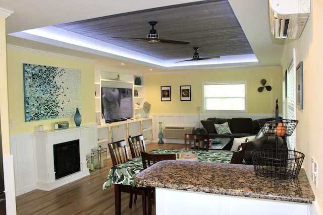 interior space with a wall mounted air conditioner, wooden ceiling, dark hardwood / wood-style floors, a raised ceiling, and white cabinets