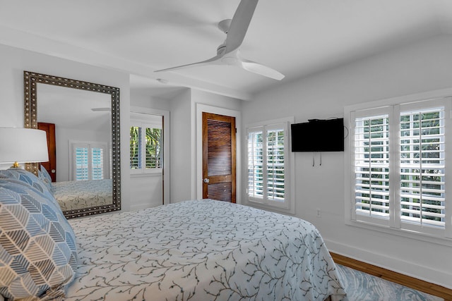 bedroom featuring hardwood / wood-style floors and ceiling fan