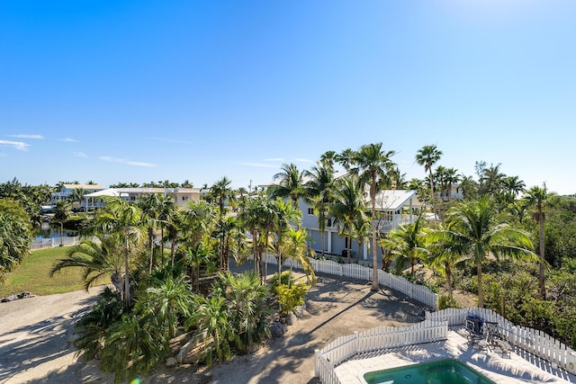 view of swimming pool with a patio and a water view