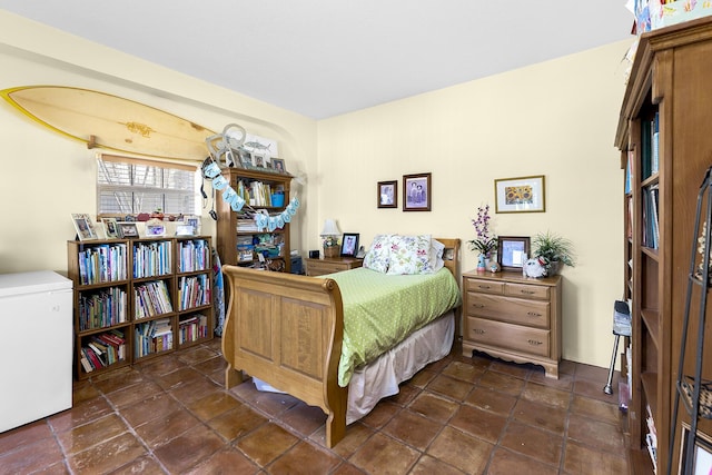 bedroom with refrigerator