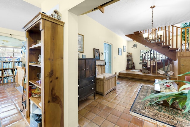 interior space featuring an inviting chandelier, decorative light fixtures, and light tile patterned flooring