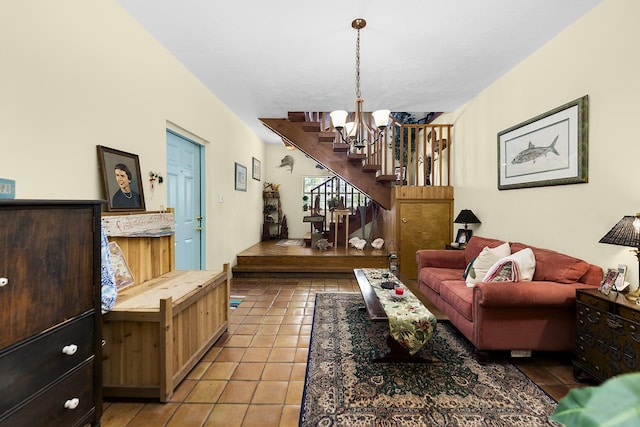 tiled living room featuring an inviting chandelier