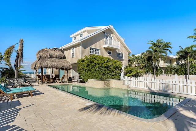 view of swimming pool with a gazebo and a patio