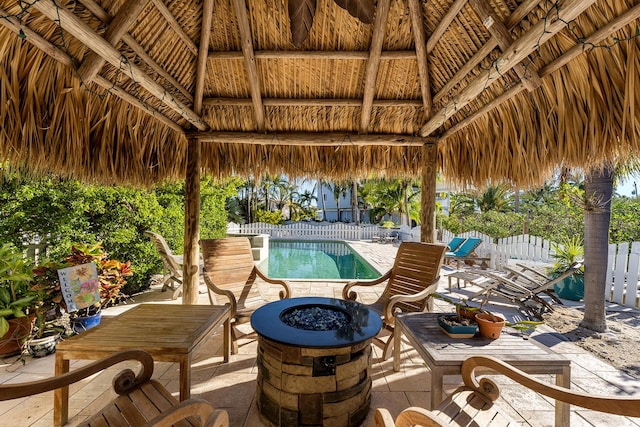 view of pool featuring a gazebo, a patio area, and an outdoor fire pit