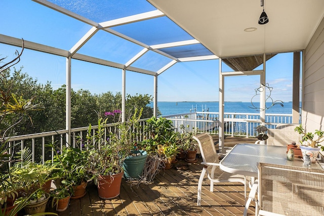 deck with a water view and a lanai