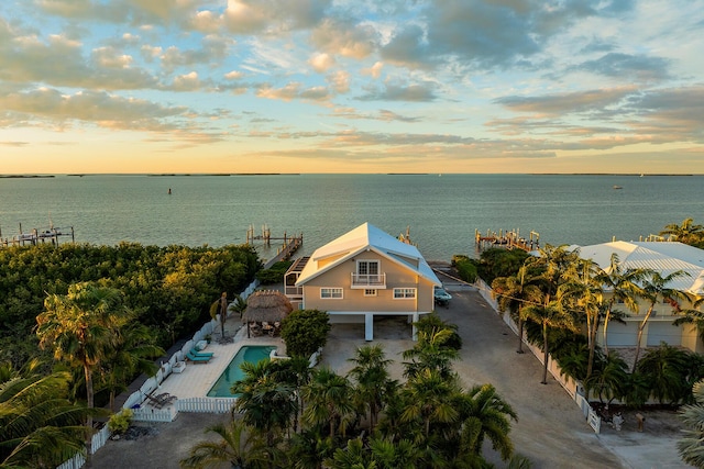 aerial view at dusk with a water view