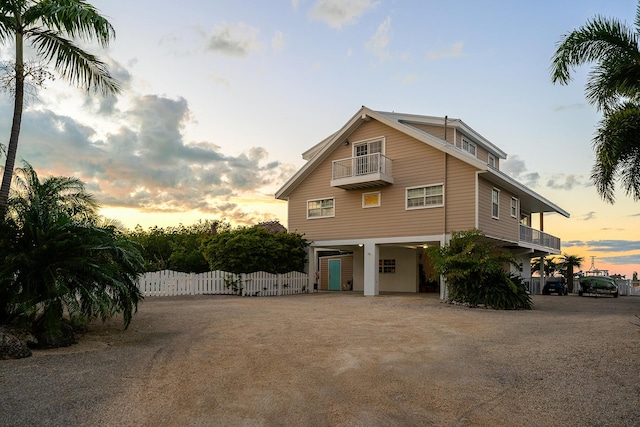 view of front of home featuring a balcony