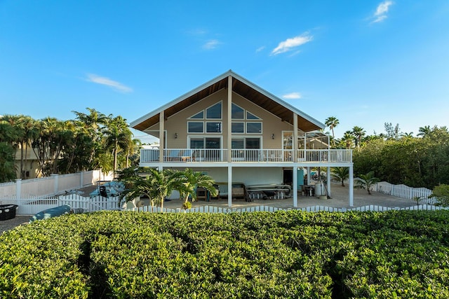 back of property with a patio and a balcony