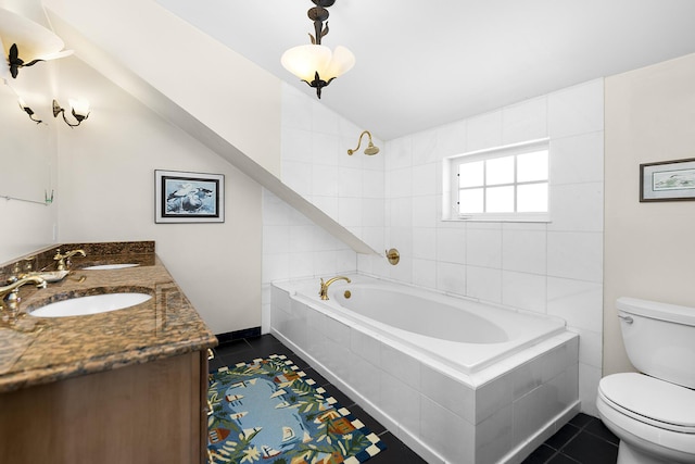 bathroom with lofted ceiling, vanity, tiled bath, tile patterned floors, and toilet