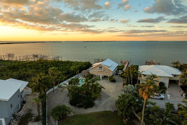 aerial view at dusk with a water view