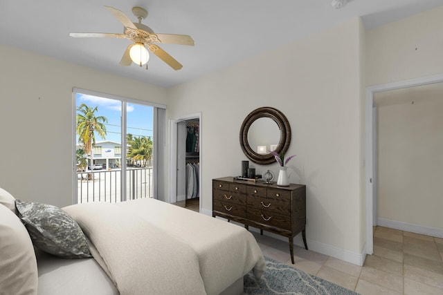 bedroom featuring light tile patterned floors, a closet, baseboards, access to outside, and ceiling fan