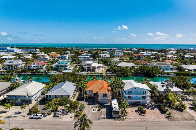 bird's eye view with a residential view and a water view