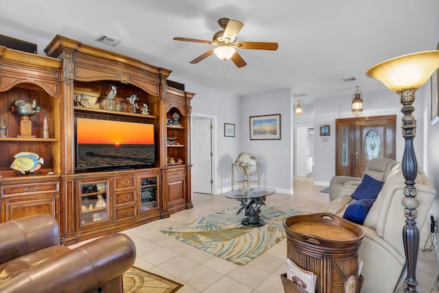 living room featuring light tile patterned floors and ceiling fan