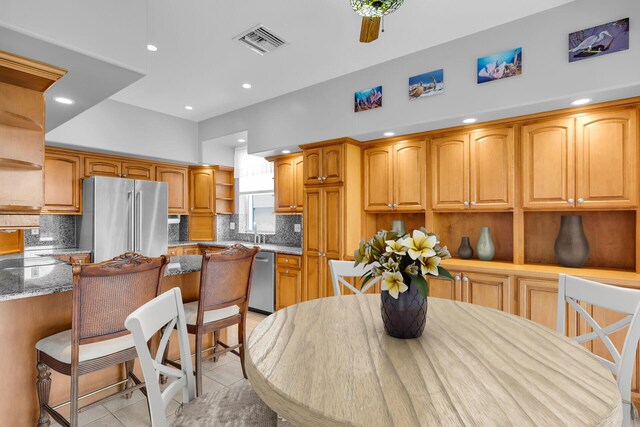 dining room with visible vents, recessed lighting, and light tile patterned floors