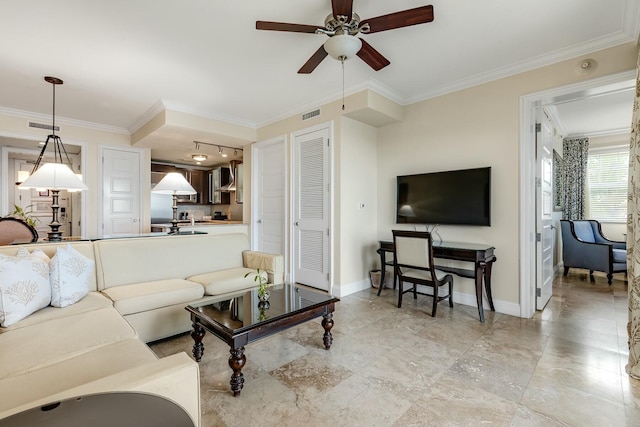 living area featuring visible vents, ornamental molding, and baseboards