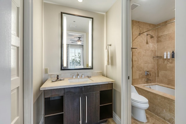 full bathroom with toilet, bathtub / shower combination, visible vents, and vanity