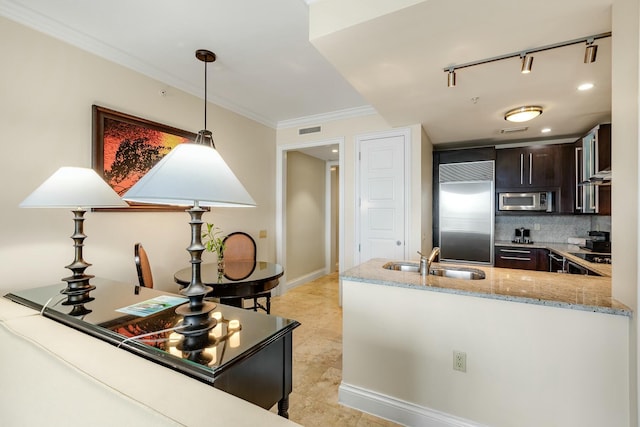 kitchen with dark brown cabinetry, visible vents, built in appliances, light stone countertops, and a sink