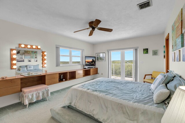 bedroom with ceiling fan, carpet floors, and access to outside