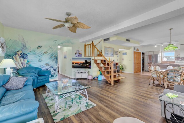 living room with dark hardwood / wood-style floors and ceiling fan