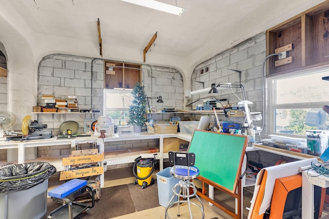 interior space with concrete flooring and a workshop area