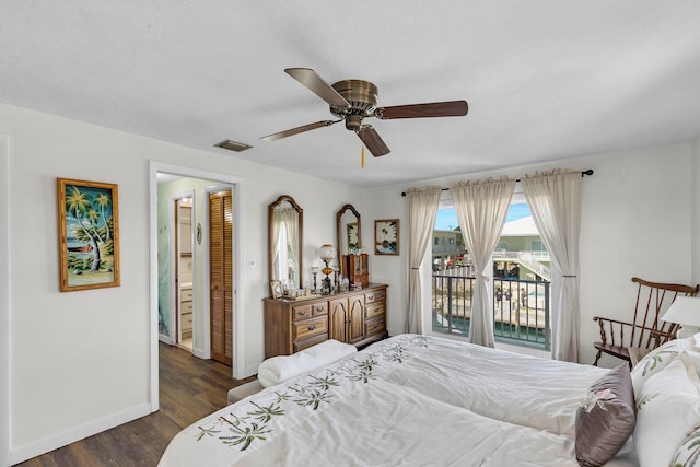 bedroom featuring dark wood-type flooring, ceiling fan, access to exterior, and ensuite bath