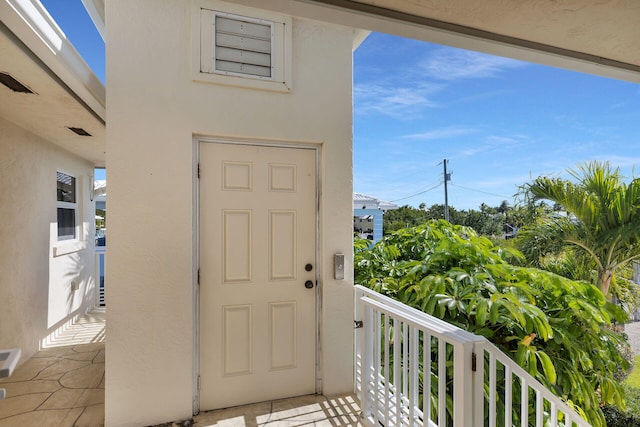 property entrance with a balcony