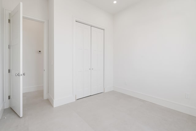 unfurnished bedroom featuring a closet