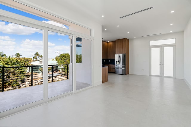 unfurnished living room with french doors
