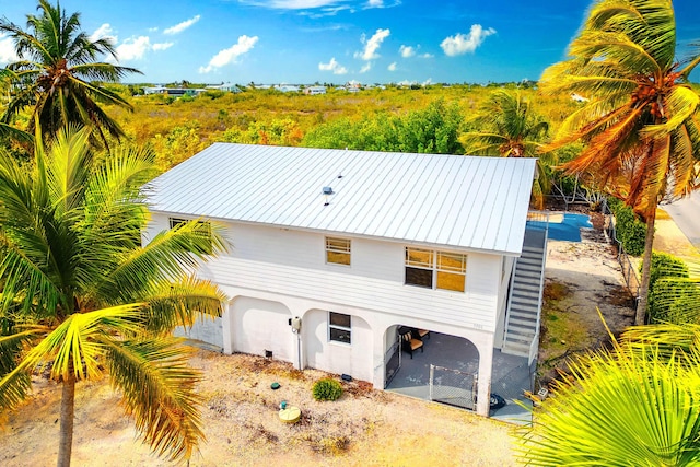 view of front of home with metal roof and stucco siding