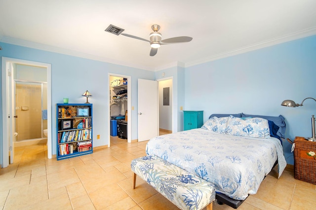 tiled bedroom with a closet, visible vents, crown molding, and a spacious closet