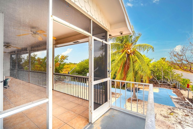 balcony featuring ceiling fan and a patio