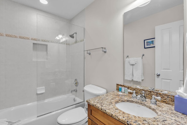 full bathroom with vanity, toilet, and tiled shower / bath combo