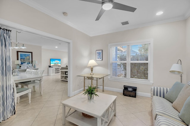 living room featuring light tile patterned flooring, ceiling fan, and ornamental molding