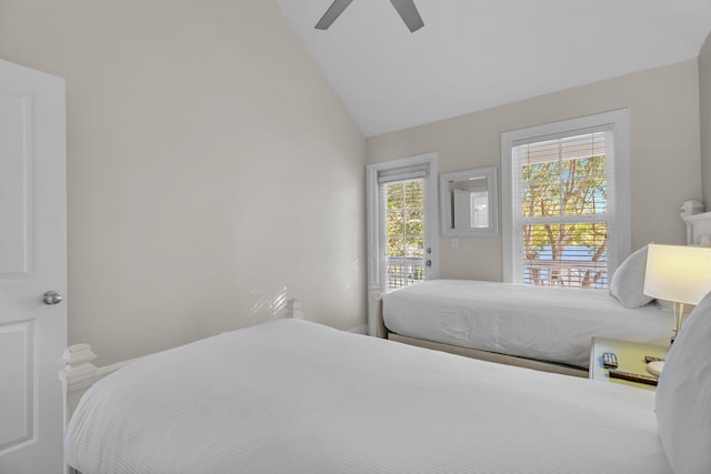 bedroom with vaulted ceiling, access to outside, and ceiling fan