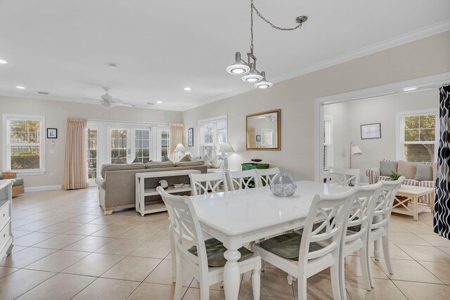 living room with french doors, ceiling fan, ornamental molding, and light tile patterned floors