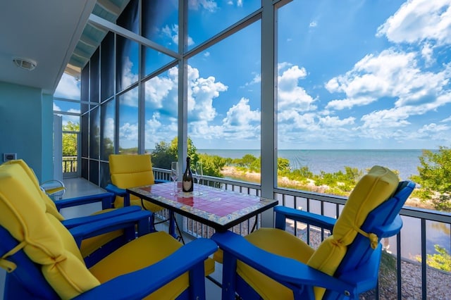 sunroom with a water view