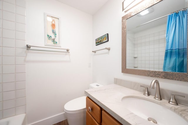 full bathroom featuring vanity, shower / bath combination with curtain, and toilet