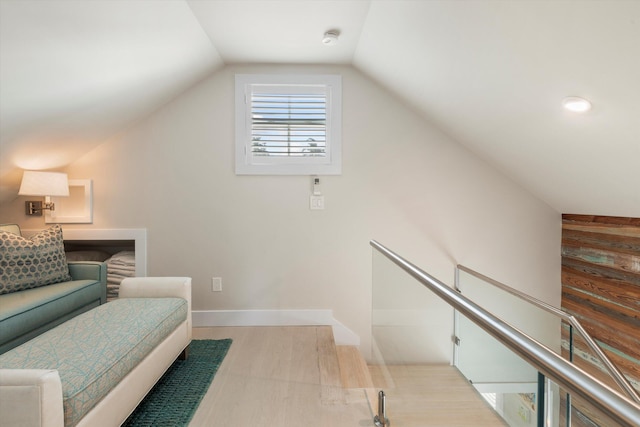 interior space featuring light hardwood / wood-style flooring and vaulted ceiling