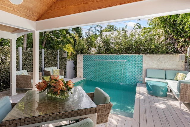 wooden deck with an outdoor living space