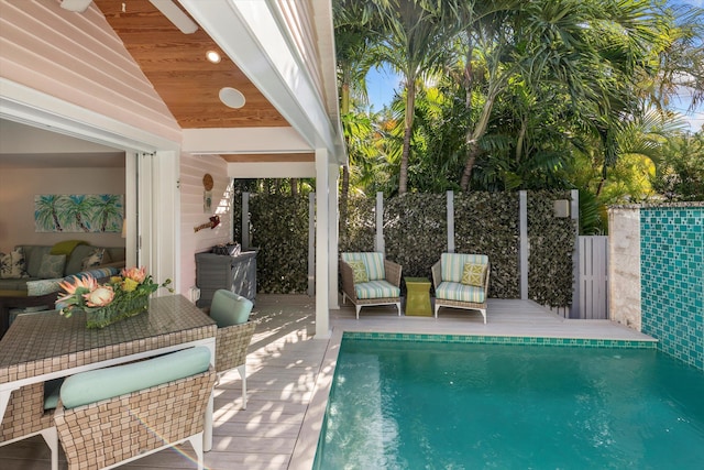 view of pool with an outdoor hangout area and a deck