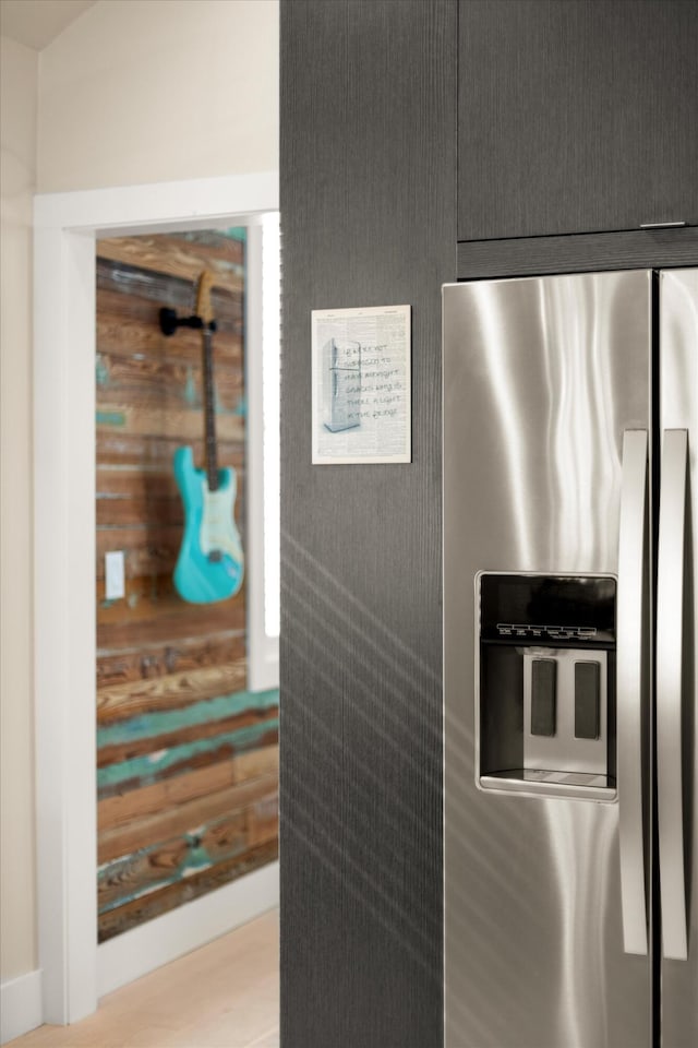 room details featuring stainless steel fridge with ice dispenser